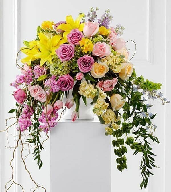 Display of Affection Arrangement - yellow lilies, stock flowers, roses, spray roses, freesia, molucella, italian ruscus, stock flowers, curly willow, hydrangeas