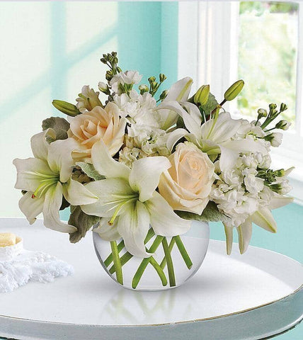 Isle of White - cream roses , white lilies , white stock , dusty miller , vase arrangement