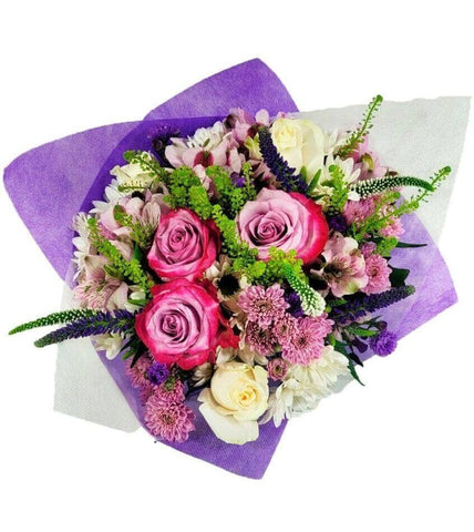 Flower Co.'s Mom's Treasure™ Bouquet is a mix of purple and lavender tones in unique blooms like roses, speedwells, alstroemeria and chrysanthemums.