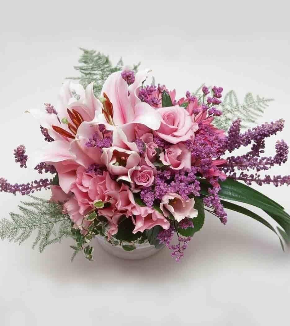 Sweet Pea Flower™ Bouquet - vase with sweet peas (substituted with lisianthus when out of season), lilies, spray roses, mauve heather, and other seasonal pink flowers